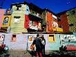 Street Market And Colourful Buildings, La Boca, Buenos Aires, Argentina by Tom Cockrem Limited Edition Print