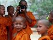 Novice Monks Learning Workings Of Camera, Mae Hong Son, Thailand by Alain Evrard Limited Edition Print