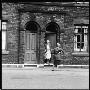 Two Women Gossip On The Doorstep In A Sheffield Street by Henry Grant Limited Edition Print