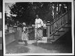 Two Women And A Girl Outside By The Front Entrance Of Their Home by Wallace G. Levison Limited Edition Pricing Art Print