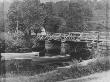 Three Row Boats Tied To A Small Bridge In The Country by Wallace G. Levison Limited Edition Print