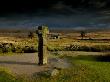 Nun's Cross, With Nun's Cross Farm Behind, Stormy Sky, Dartmoor, Devon, Uk by Ross Hoddinott Limited Edition Print
