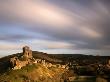 Corfe Castle And Corfe Village, Late Evening Light, Dorset, Uk. November 2008 by Ross Hoddinott Limited Edition Print