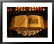 Open Bible And Prayer Candles In Background by Sylvia Bissonnette Limited Edition Print