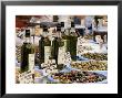 Olives And Olive Oil On Sale At A Market, Provence-Alpes-Cote-D'azur, France by Ruth Tomlinson Limited Edition Print