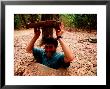 American Visitor Explores Tunnel At Former War Time Cu Chi Tunnel System, Ho Chi Minh, Vietnam by Stu Smucker Limited Edition Print