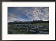 The Sawtooth Mountain Range Is A Backdrop For A Split-Rail Fence by Michael Melford Limited Edition Print