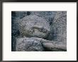 The Head Of A Forty-Four-Foot-Long Granite Statue Of A Reclining Buddha Entering Nirvana by Mattias Klum Limited Edition Print