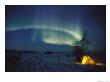 The Northern Lights Shine Over A Campsite by Paul Nicklen Limited Edition Print