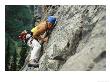 Young Woman Climbs Cliff At Lake Louise by Mark Cosslett Limited Edition Pricing Art Print