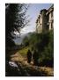 Monks Walk Along A Path Outside A Monastery by Eightfish Limited Edition Print