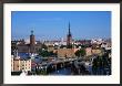 Cityscape With Town Hall On Left And Gamla Stan District, Stockholm, Sweden by Wayne Walton Limited Edition Print