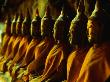 Nine Buddha Statues Sitting In Row In Khao Luang Caves, Phetburi, Phetchaburi, Thailand by Chris Mellor Limited Edition Pricing Art Print
