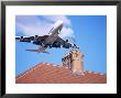 Low-Flying Aircraft Over Rooftops Near London Heathrow Airport, Greater London, England by Mark Mawson Limited Edition Print