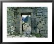 View Through Stone Doorway Of The Inca Ruins Of Machu Picchu In The Andes Mountains, Peru by Jim Zuckerman Limited Edition Print