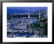 Overhead View Of The Marina At Granville Island, With City In Distance, Vancouver, Canada by Mark & Audrey Gibson Limited Edition Print