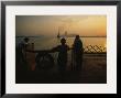 Riders On The Staten Island Ferry Look Out At The Manhattan Skyline by Maria Stenzel Limited Edition Print