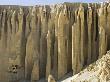 Cliffs With Caves Used As Buddhist Retreats, In Mustang, Nepal by Stephen Sharnoff Limited Edition Print