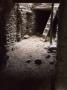 Dark Inner Courtyard In Mustang With Wooden Ladder And Dirt Floor by Stephen Sharnoff Limited Edition Print