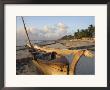 Canoe Pulled Up Onto Beach At Dusk, Bamburi Beach, Near Mombasa, Kenya, Africa by Charles Bowman Limited Edition Pricing Art Print