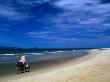 Cycling Along Cua Dai Beachfront, Hoi An, Quang Nam, Vietnam by Bernard Napthine Limited Edition Print