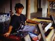 Woman Weaving On Traditional Loom In Workshop, Lombok, Indonesia by Richard I'anson Limited Edition Print