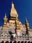 Man Clambering On Pha That Luang (Great Sacred Reliquary Or Great Stupa), Vientiane, Laos by Bernard Napthine Limited Edition Print