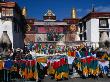 Colourful Prayer Flags In Square Outside Traditional Building, Lhasa, Tibet by Bill Wassman Limited Edition Print