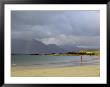 Lone Person On A Sandy Beach Under A Stormy Sky, Near Tully Cross, Connemara, Connacht by Gary Cook Limited Edition Print