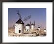 Windmills Above The Village, Consuegra, Ruta De Don Quixote, Castilla La Mancha, Spain by Michael Busselle Limited Edition Print