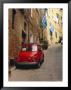 Red Car Parked In Narrow Street, Siena, Tuscany, Italy by Ruth Tomlinson Limited Edition Print