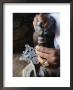 Close-Up Of Blacksmith's Hands Working On Metal Cross, Axoum (Axum) (Aksum), Tigre Region, Ethiopia by Bruno Barbier Limited Edition Print