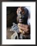 Close-Up Of Blacksmith's Hands Working On Metal Cross, Axoum (Axum) (Aksum), Tigre Region, Ethiopia by Bruno Barbier Limited Edition Print