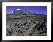 Hikers Moving Through A Rocky Area, Kilimanjaro by Michael Brown Limited Edition Print