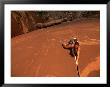 A Young Woman Climbing In Canyonlands National Park by Jimmy Chin Limited Edition Print