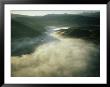An Aerial View Of A Fog-Filled Valley On The Monterey Peninsula by Bill Curtsinger Limited Edition Print