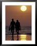 Couple Walking On Beach At Sunset, Sarasota, Florida, Usa by Maresa Pryor Limited Edition Print