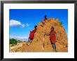 Three Young Maasai Goat Herds On A Termite Mound, Longido, Arusha, Tanzania by Ariadne Van Zandbergen Limited Edition Print