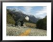 Man Going Down Hill On Longboard Skate, Treble Cone, Wanaka, New Zealand by Christian Aslund Limited Edition Print