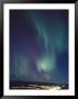 The Aurora Borealis Over A City by Paul Nicklen Limited Edition Print