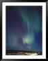 The Aurora Borealis Over A City by Paul Nicklen Limited Edition Print