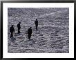 Men Walking Across Cobblestones Of The Forbidden City, Beijing, China, by Phil Weymouth Limited Edition Print