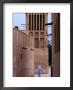 Man Walking In Lanes Of Bastikia Quarter, Dubai, United Arab Emirates by Phil Weymouth Limited Edition Print