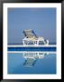 A Deck Chair Offers Poolside Relaxation To A Vacationer by Michael S. Lewis Limited Edition Print