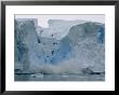 Calving Ice Falls From An Ice Formation Into Water by Maria Stenzel Limited Edition Print