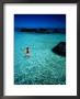 Woman Wading In Sea Off Ko Kham, Thailand by Woods Wheatcroft Limited Edition Print