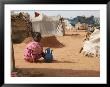 A Girl Washes Plates For Her Family In The North Darfur Refugee Camp Of El Sallam October 4, 2006 by Alfred De Montesquiou Limited Edition Print