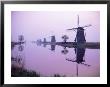 Windmills In Early Morning Mist, Kinderdijk, Unesco World Heritage Site, Holland by I Vanderharst Limited Edition Print