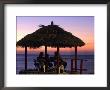 Cliffside Table At Pickled Parrot At Sunset, Negril, Jamaica by Holger Leue Limited Edition Print