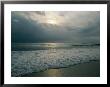 Dramatic View Of A Stormy Sunrise And The Foamy Surf by Brian Gordon Green Limited Edition Print